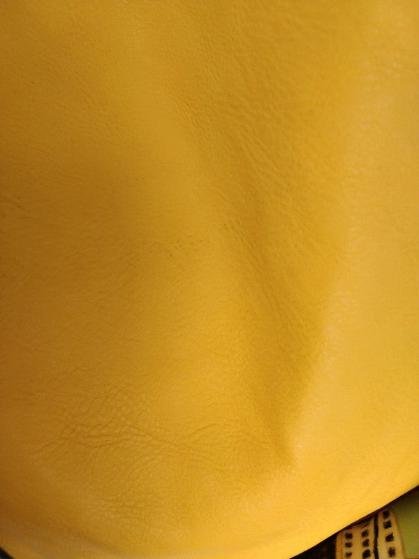 Yellow bucket bag with perforated details