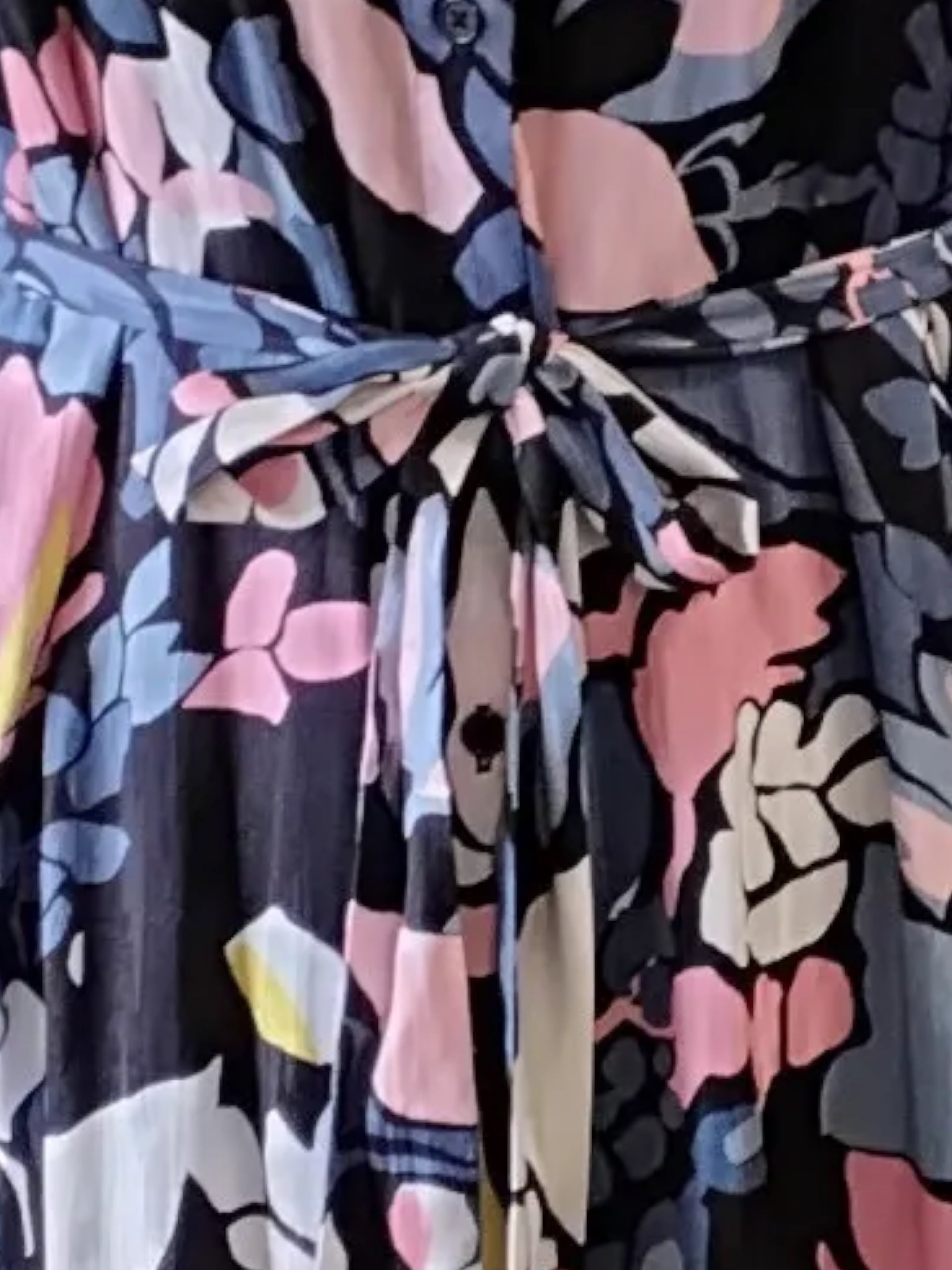 Circular Dress Collaborative long sleeve floral print button front dress with tie waist in blue, pink, yellow, and white.